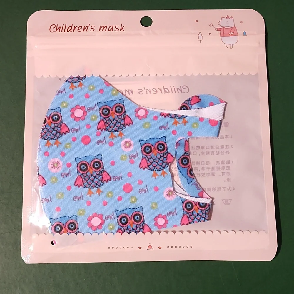 Children's re Usable face mask new in package never opened